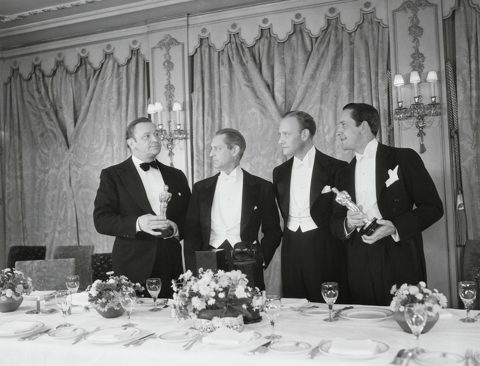 Image may contain Wallace Beery Fredric March Conrad Nagel Lionel Barrymore Clothing Formalwear and Suits