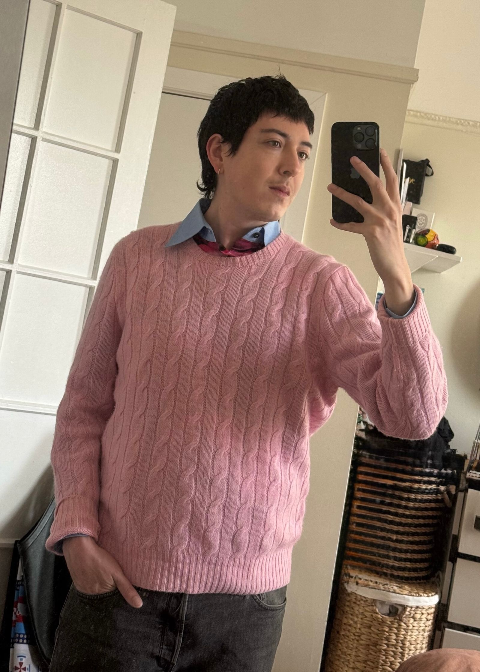 Image may contain clothing, knitwear, sweaters, adults, electronics, cell phones, phones, heads and faces