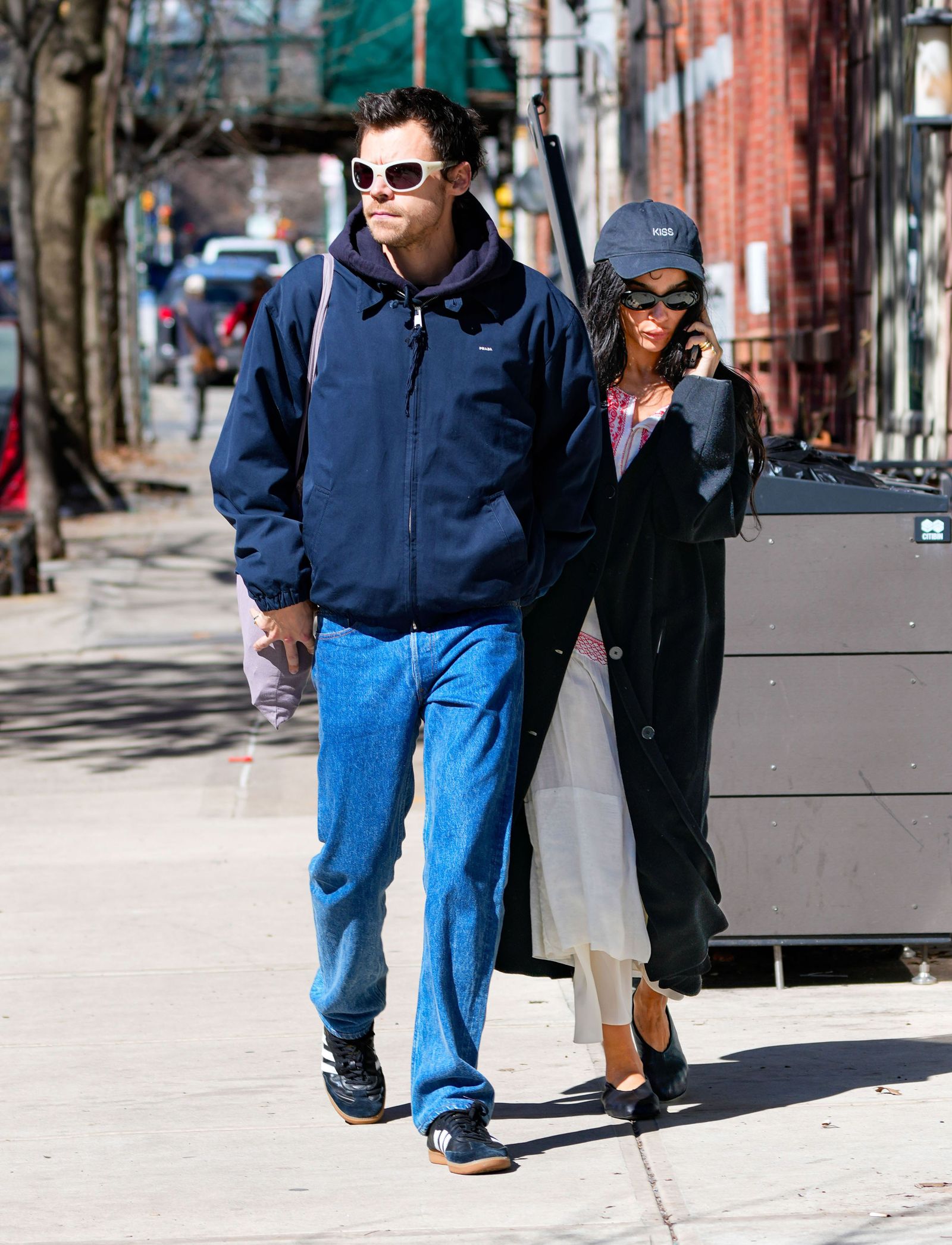 Image may contain Harry Styles Zoë Kravitz Clothing Pants Pedestrian Person Jeans Coat Adult Hoodie and Knitwear