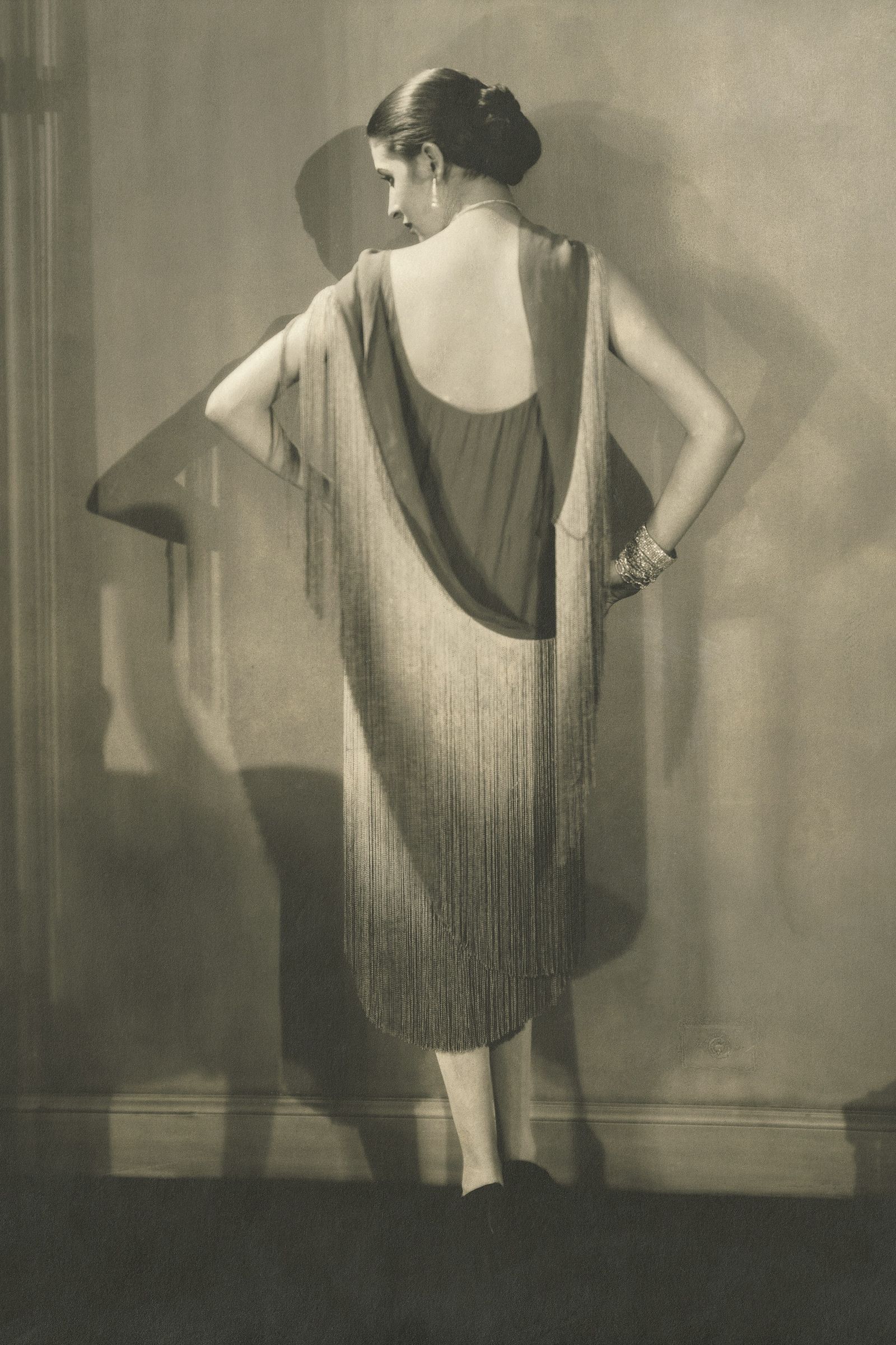 Image may contain clothing, apparel, fashion people, formal wear, home decor, linen, face, head photography and portraits