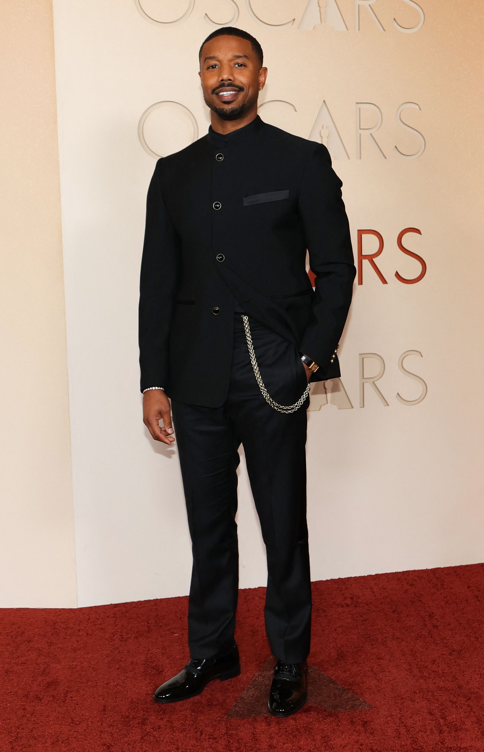 Image may contain Michael B. Jordan people standing clothing, formal wear, adult blazers, coats, jackets and heads