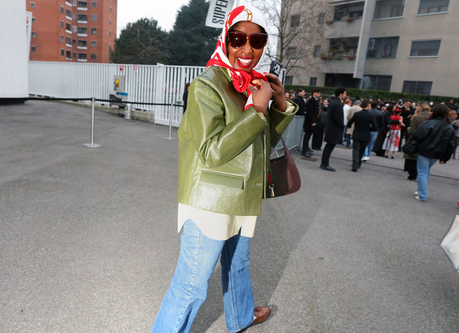 Image may contain Caraun Reid clothing, outerwear, accessories, sunglasses, people, jeans, pants, adult bags and totes