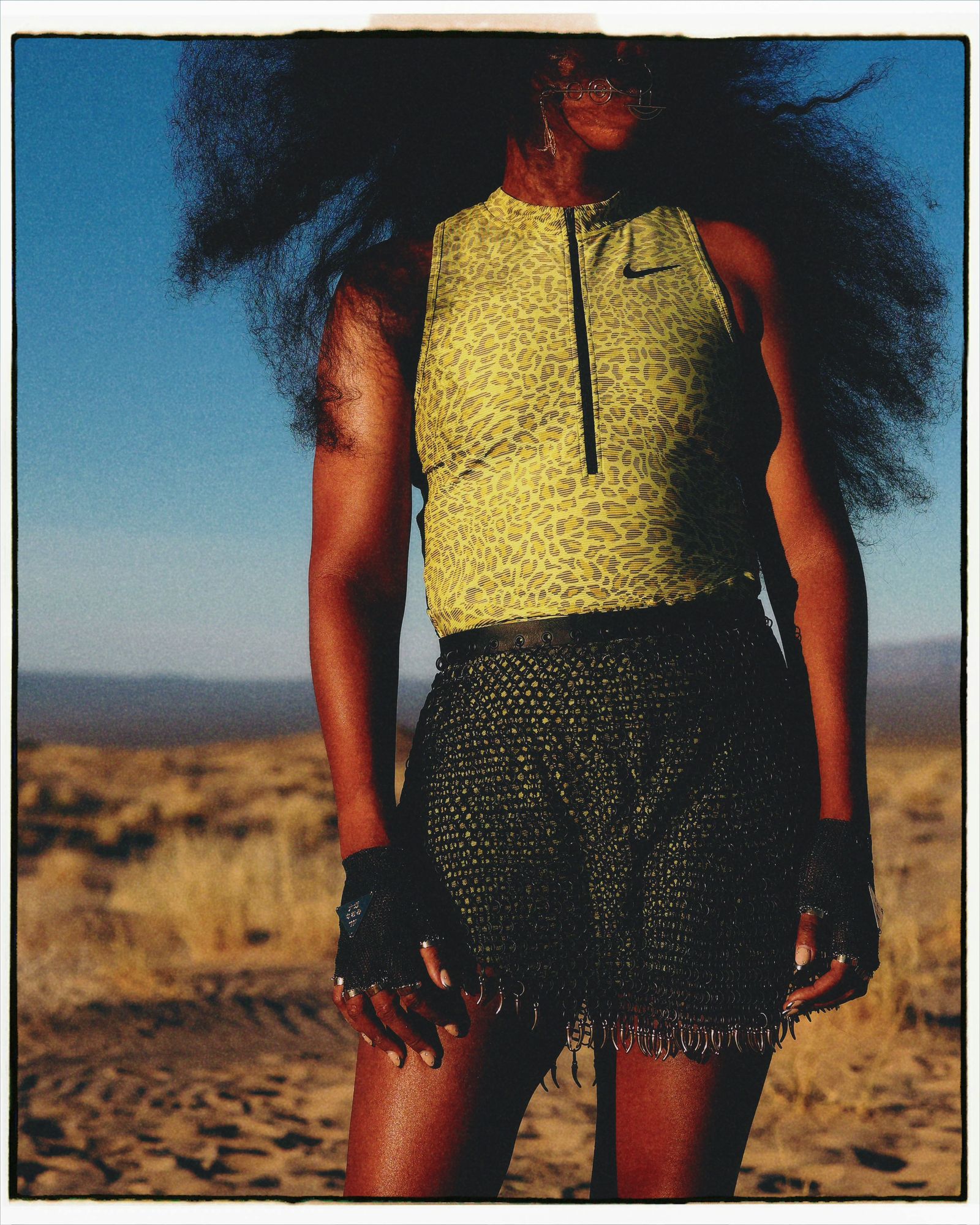 Image may contain adult shirts, clothing, beachwear and shorts