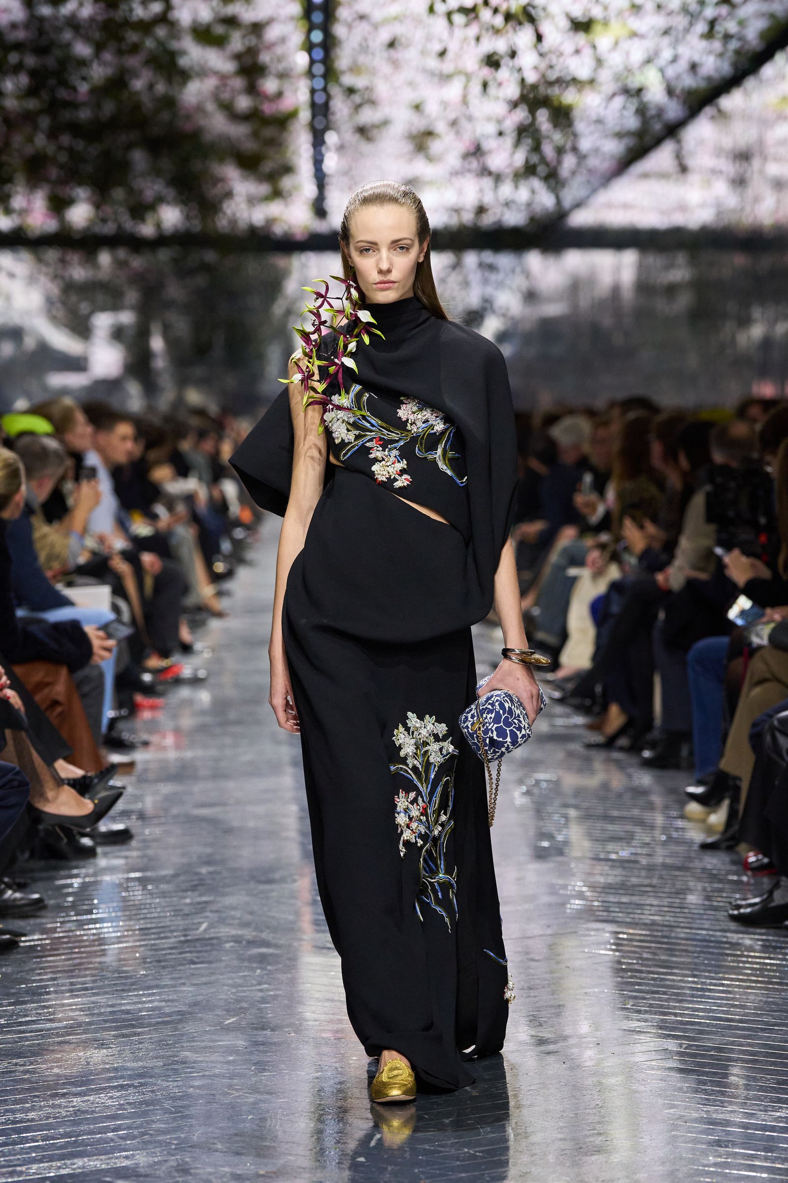 Image may contain fashionable formal attire, adult clothing, gowns, dresses, footwear, shoes and suits