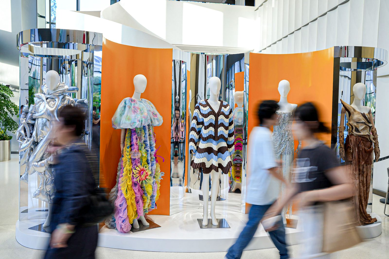 Image may contain adults and mannequins