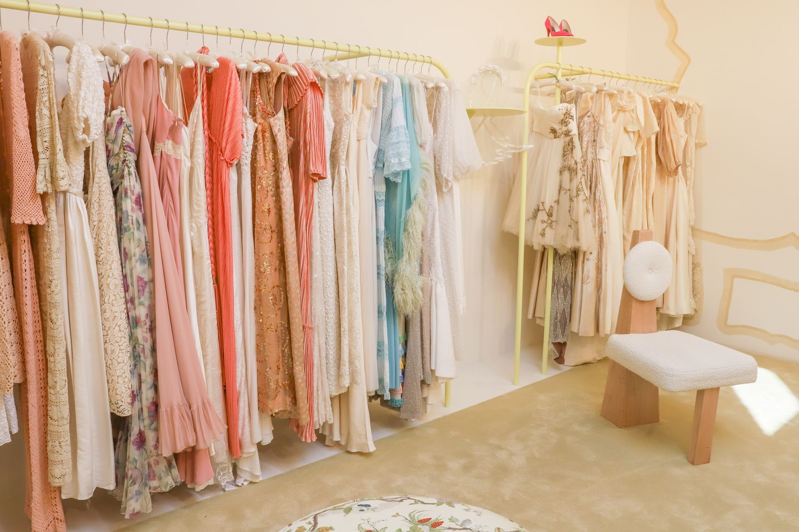 Image may contain dressing room, interior, furniture, bench, closet, boutique and shop