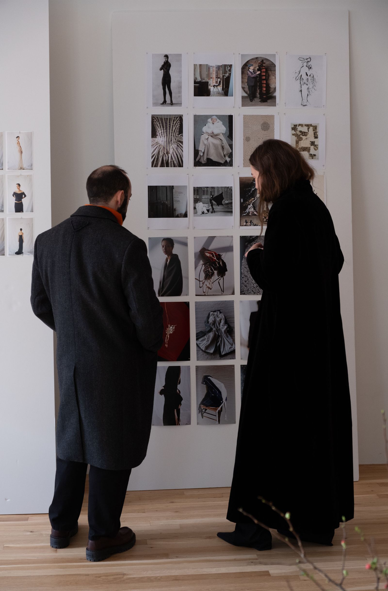 Image may contain adult clothing, outerwear, art galleries and coats