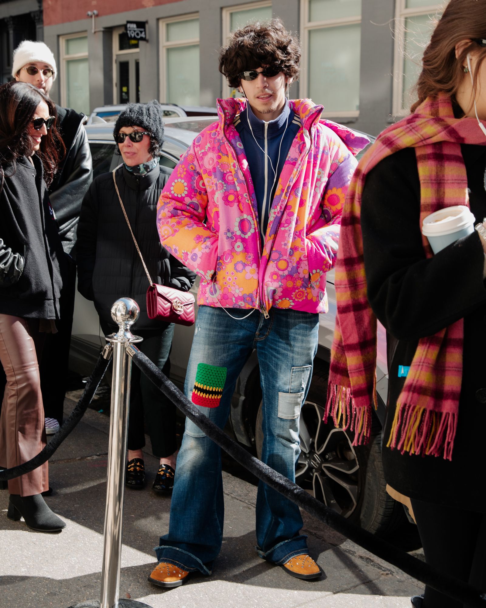 Image may contain clothing, pants, coats, jackets, adult jeans, accessories, glasses, footwear