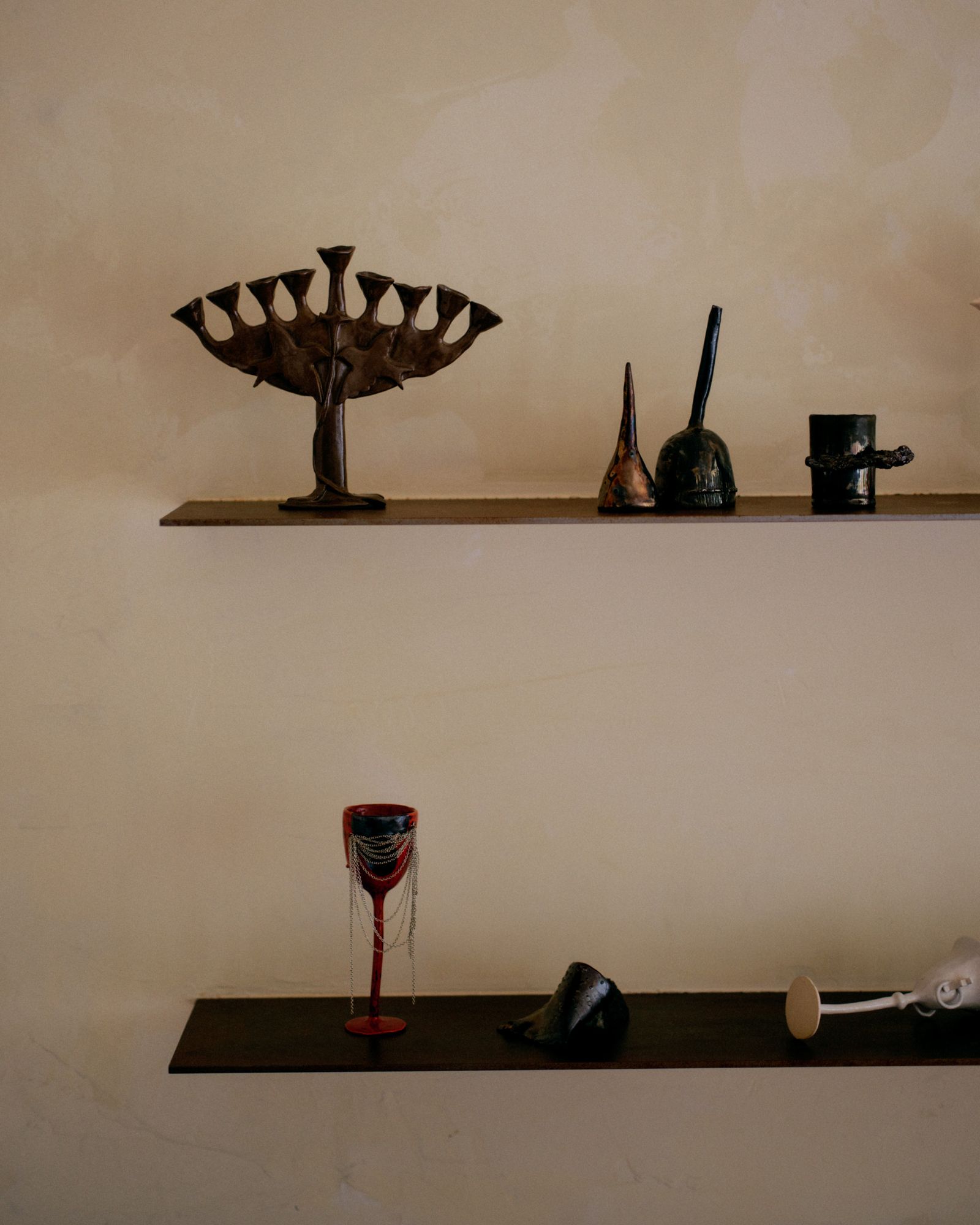 Image may contain shelvesFestival Hanukkah Menorah Glass and Furniture