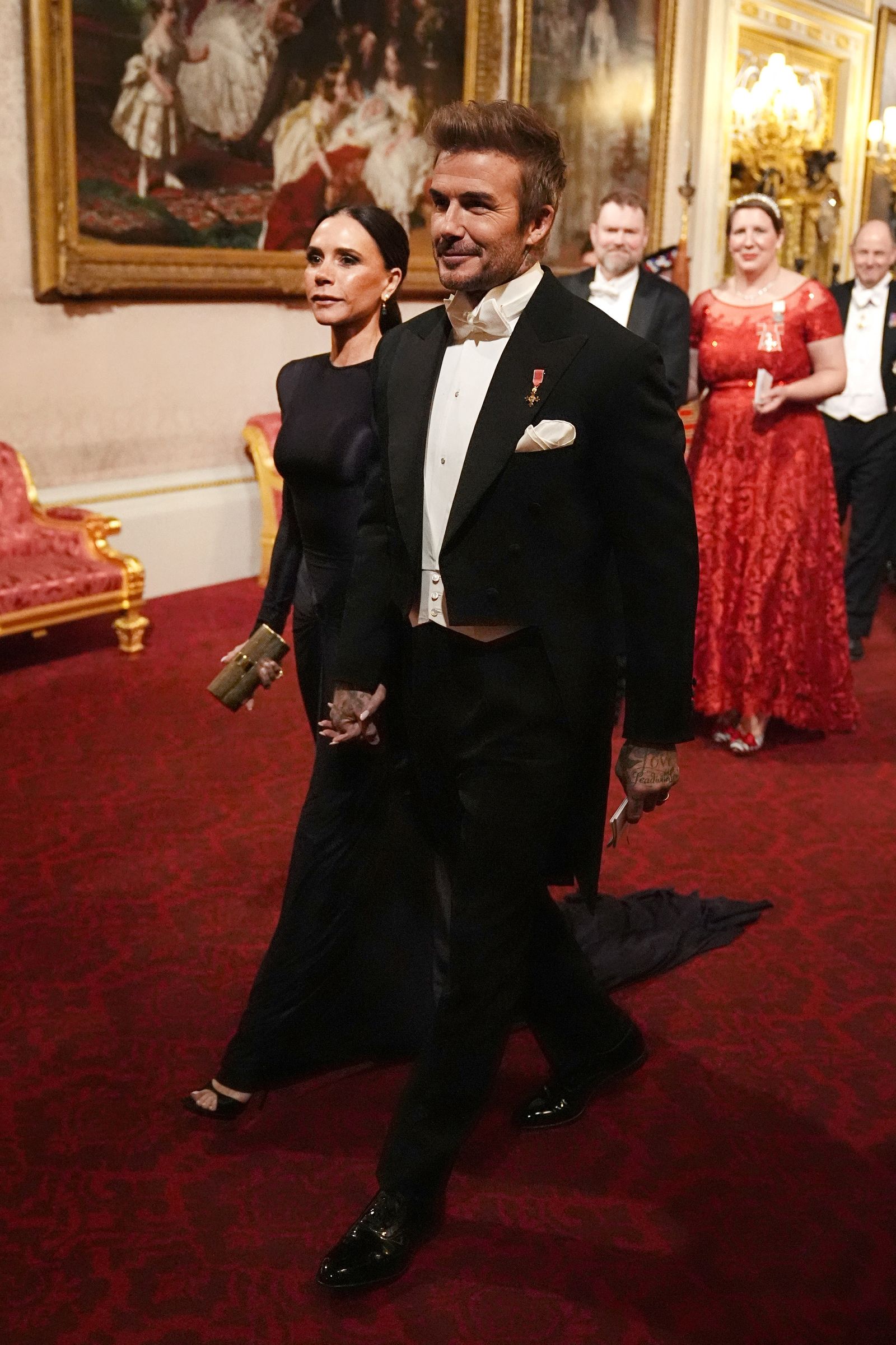 British fashion designer Victoria Beckham and former British footballer David Beckham arrive for a state dinner...