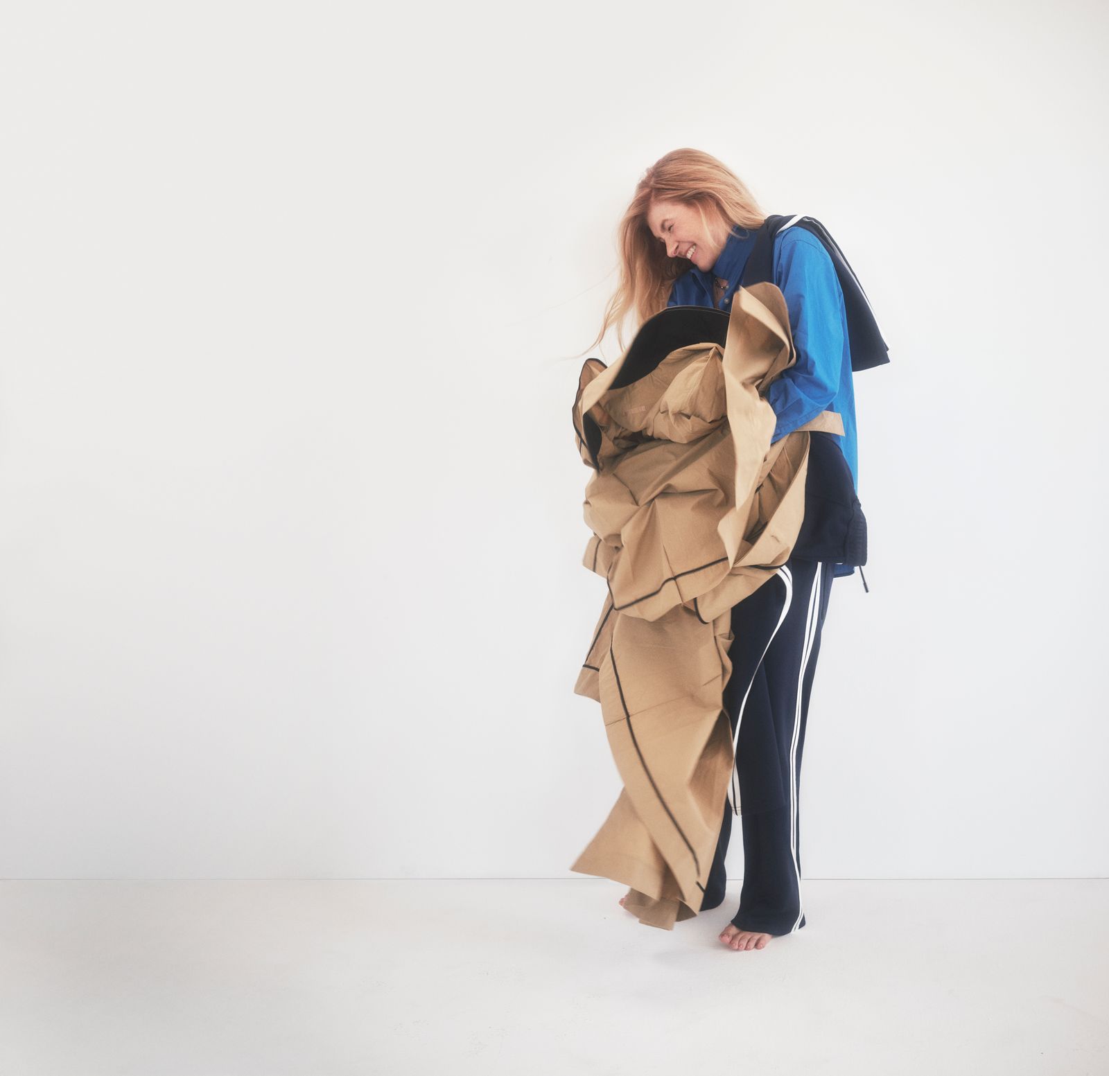 Image may contain Connie Britton, clothing, coat, face, head, people photography, portrait and adults