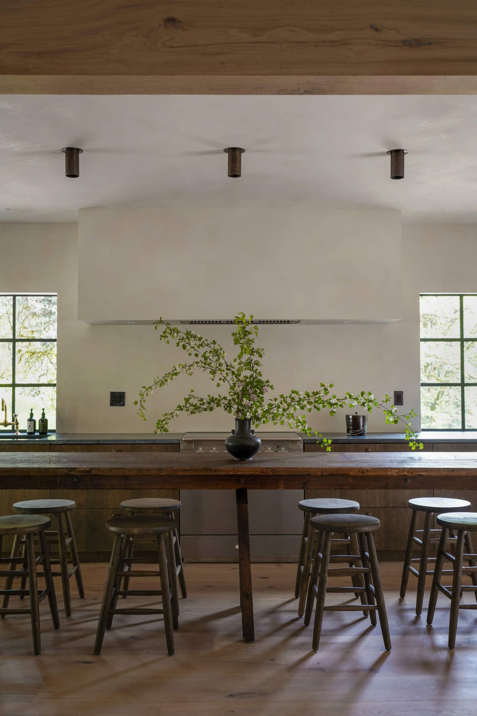 Image may contain interior interior design, bar stools, furniture, dining tables and tables