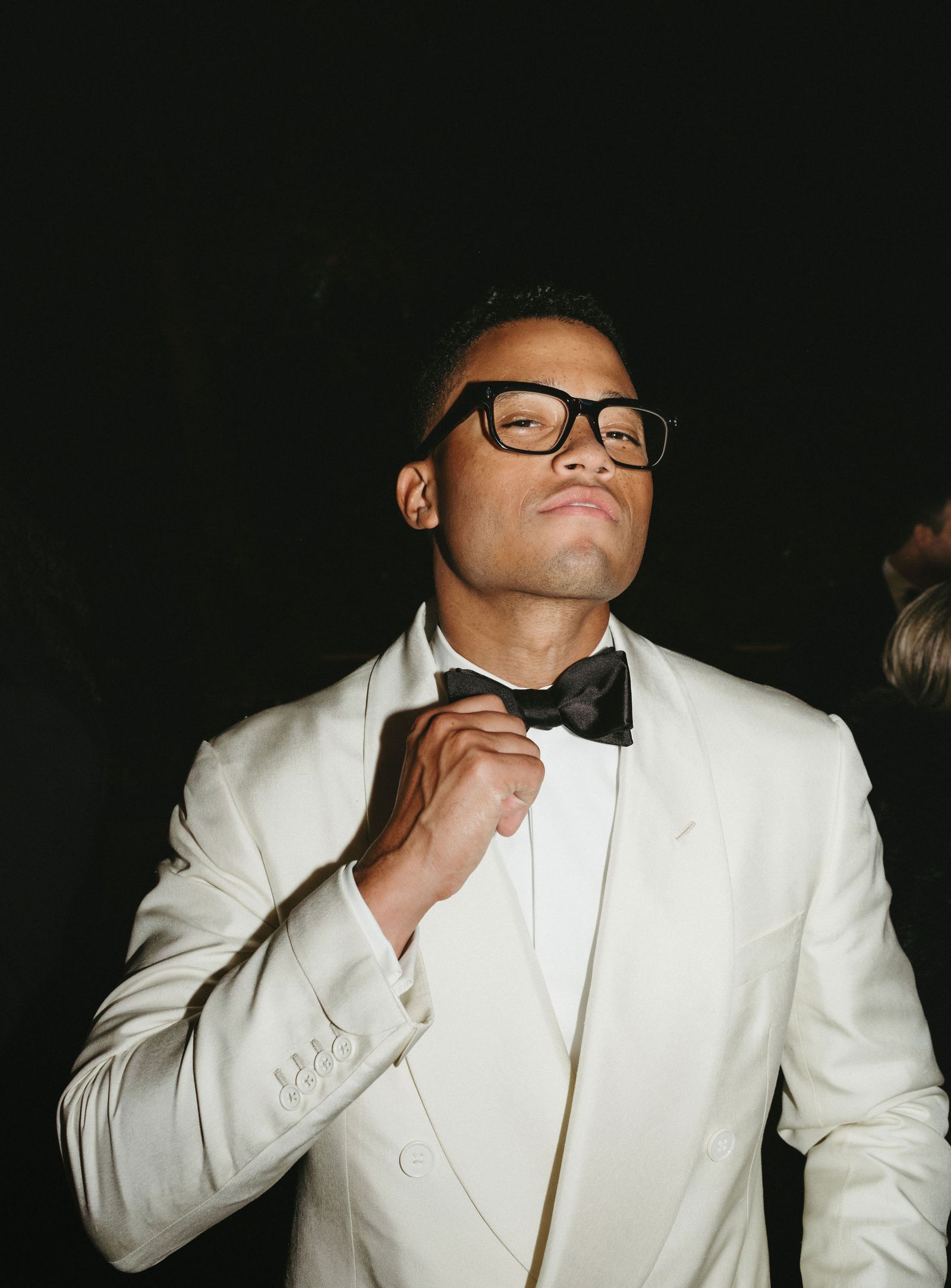 Image may contain Toby Love clothing, formal wear, suit accessories, glasses, ties, shirts, blazers, coats, jackets and tuxedos