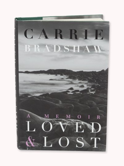 The cover of the book features a black and white photo of rocks by the sea.