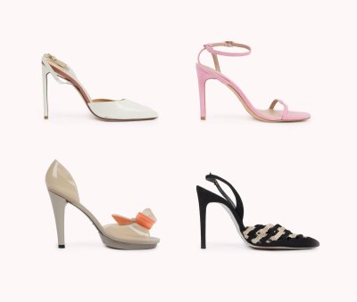 Four different high heels on a pink background.