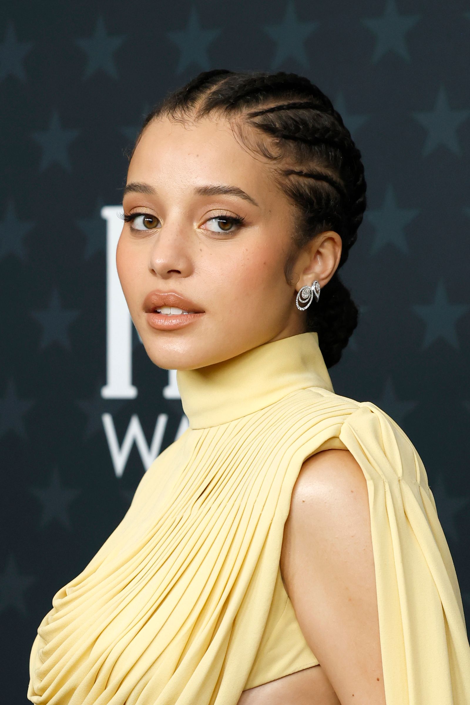 Image may contain Laura Beyne adult black hair hair shirt clothing fashion and belly button