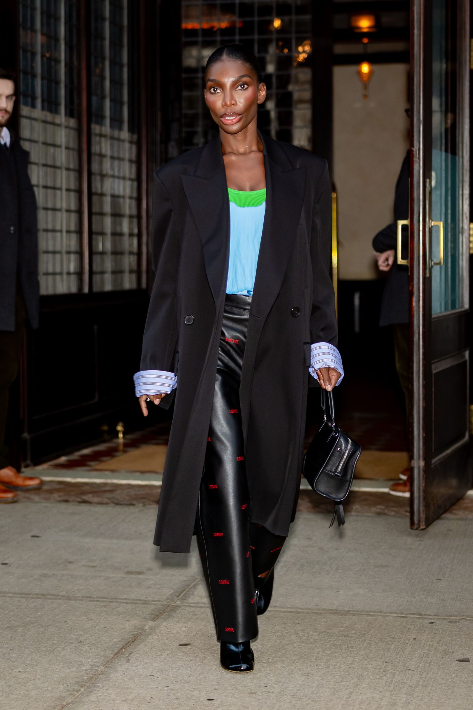 Image may contain Michaela Coel clothing jackets blazers jackets men formal suits and adults