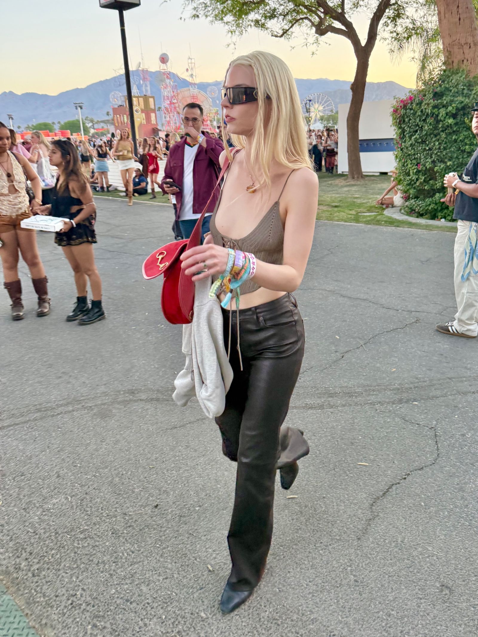 Image may contain Anya TaylorJoy Nia Long Blonde Hair Person Clothing Pants Adult Footwear Shoe and Pedestrian