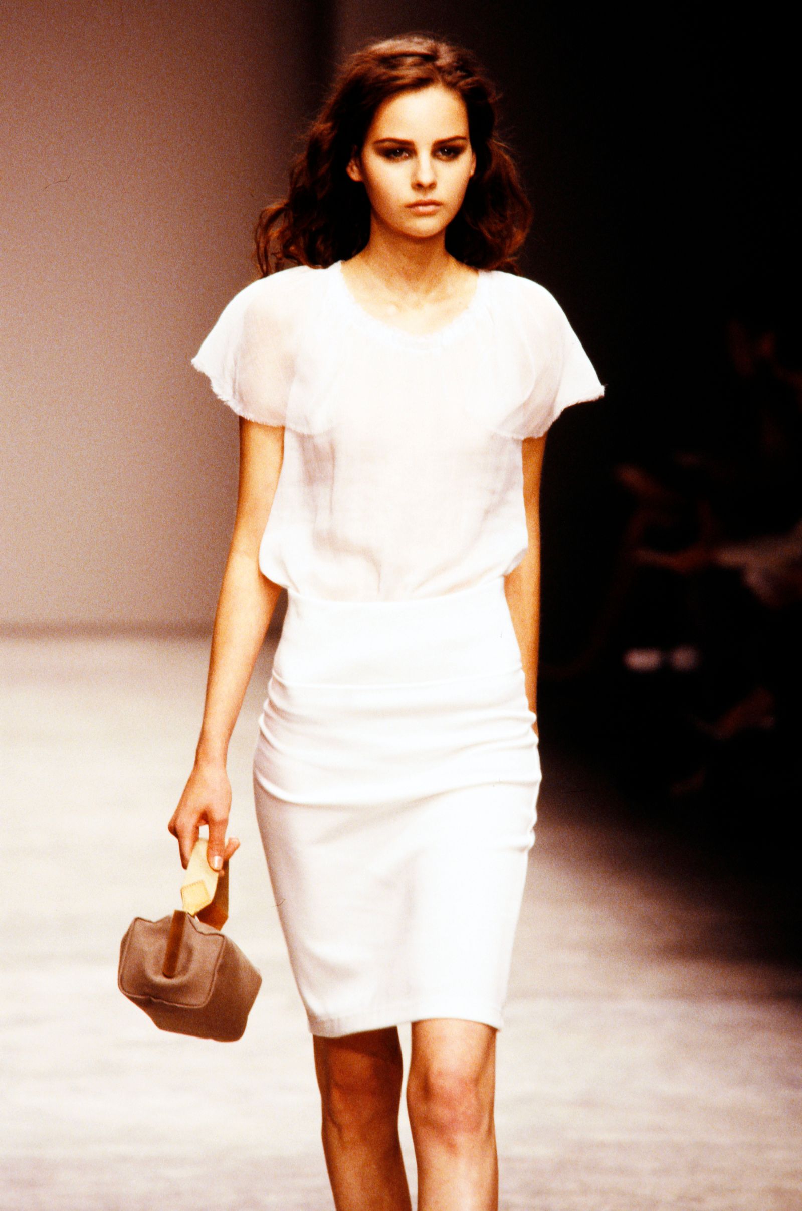 Image may contain shirt, clothing, accessories, bag, handbag, adult, fashion apparel, sleeves, face, head and wallet