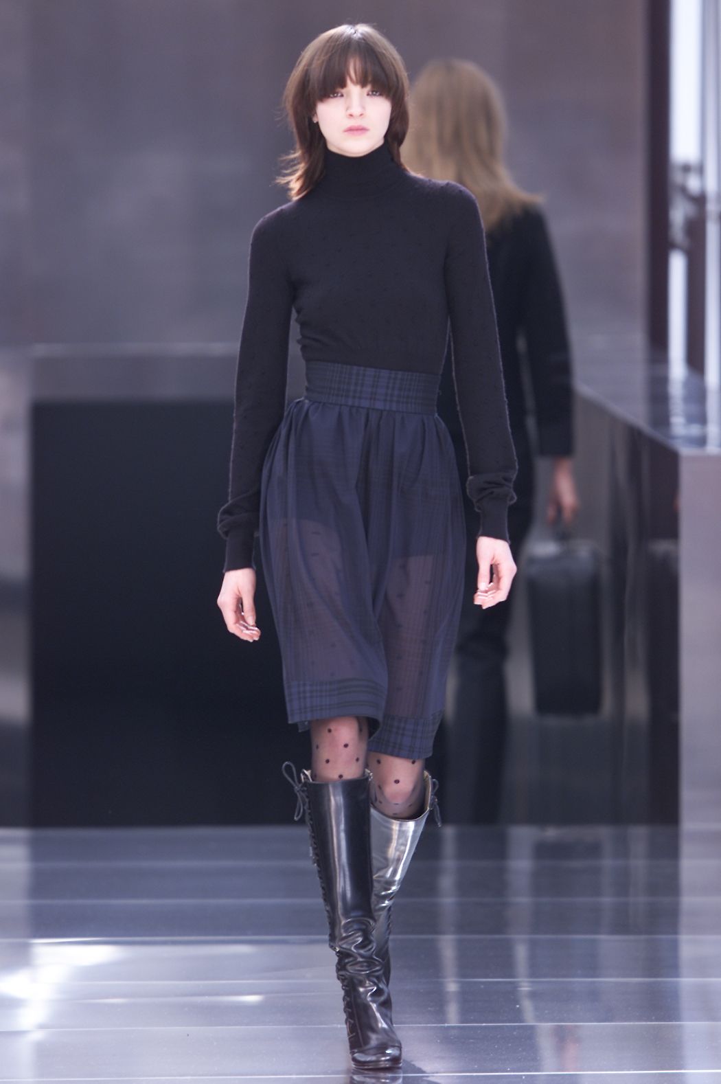 Image may contain clothing, clothing, sleeves, people, footwear, long sleeve shoes and runway