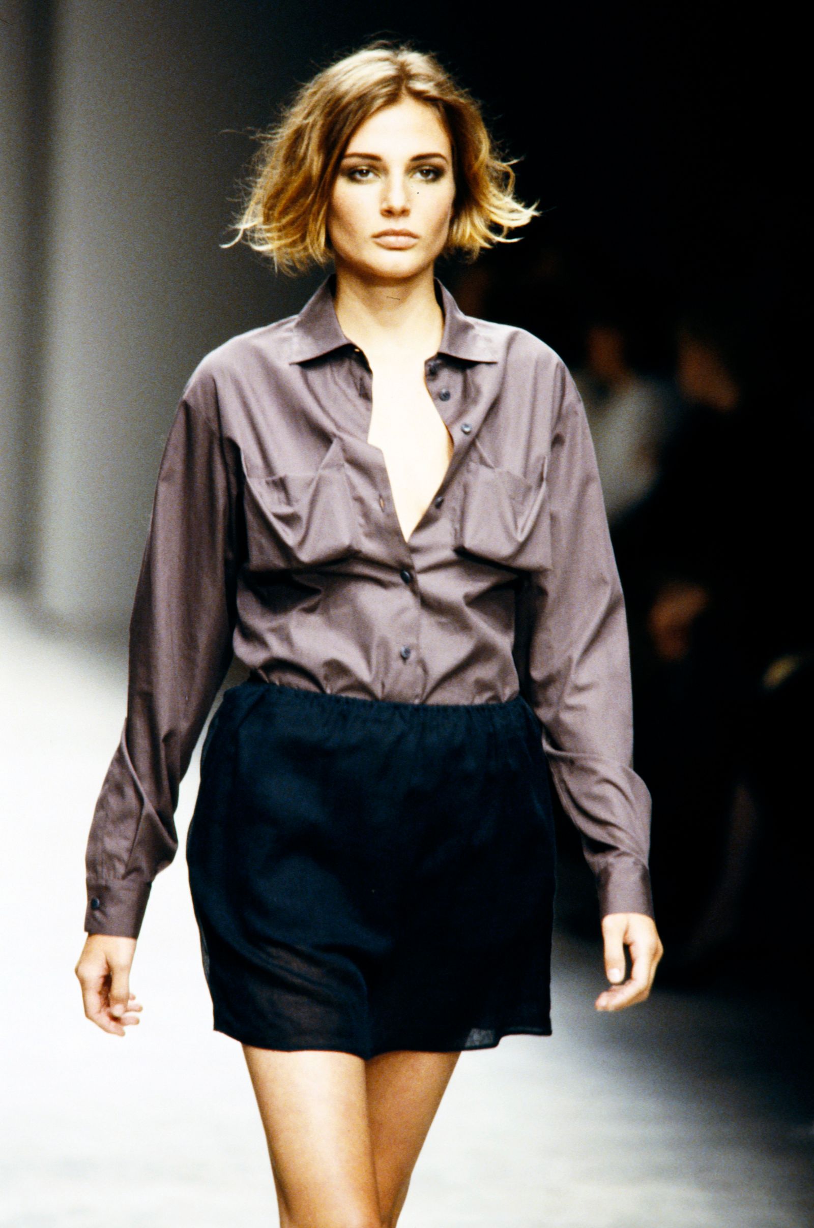 Image may contain Bridget Hall shirt, clothing, long sleeves, sleeves, adult fashion, coat, face, head and skirt