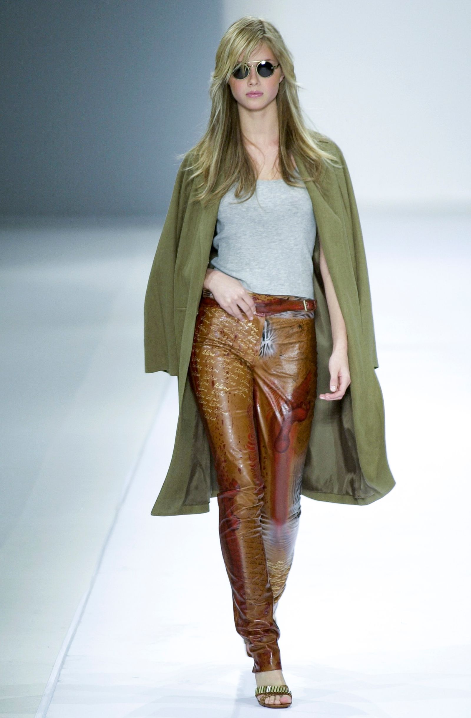 Image may contain Ana Cludia Michels Fashion Cape Clothing Adults and Coats