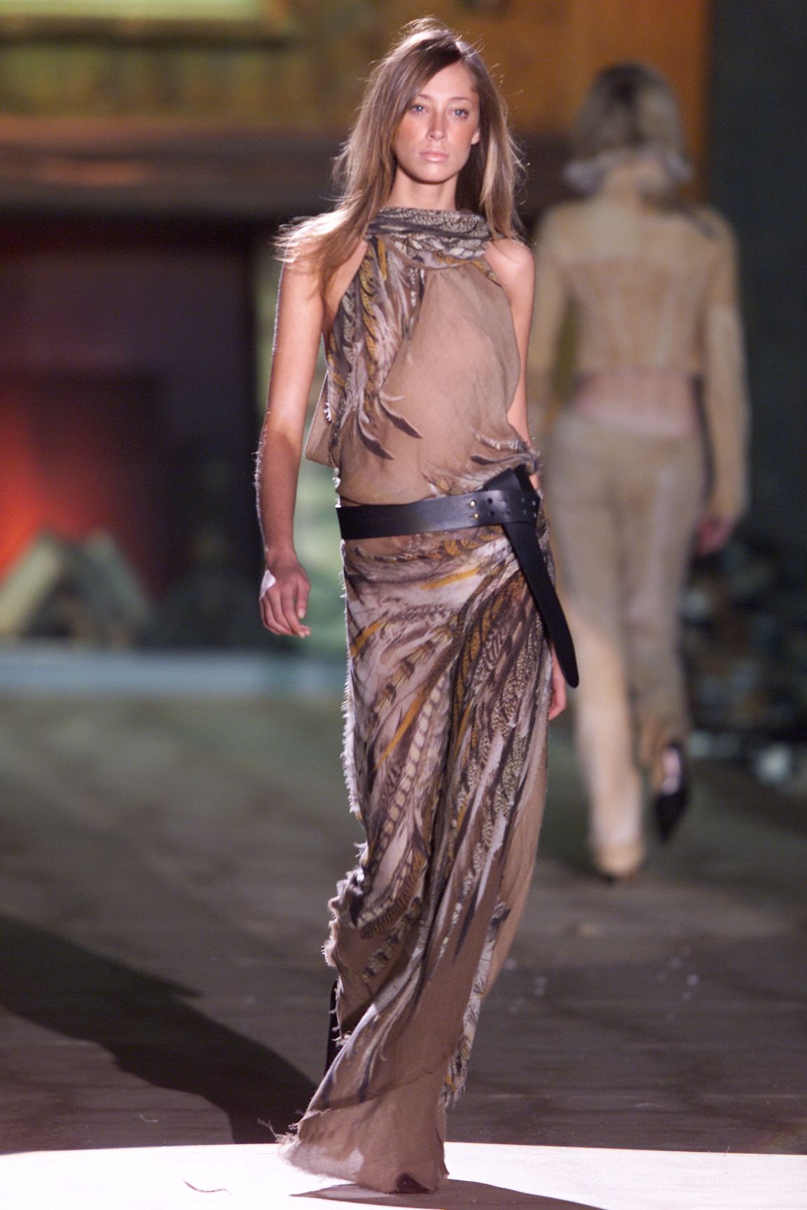 Image may contain fashionable adult clothing, footwear, formal wear and dresses