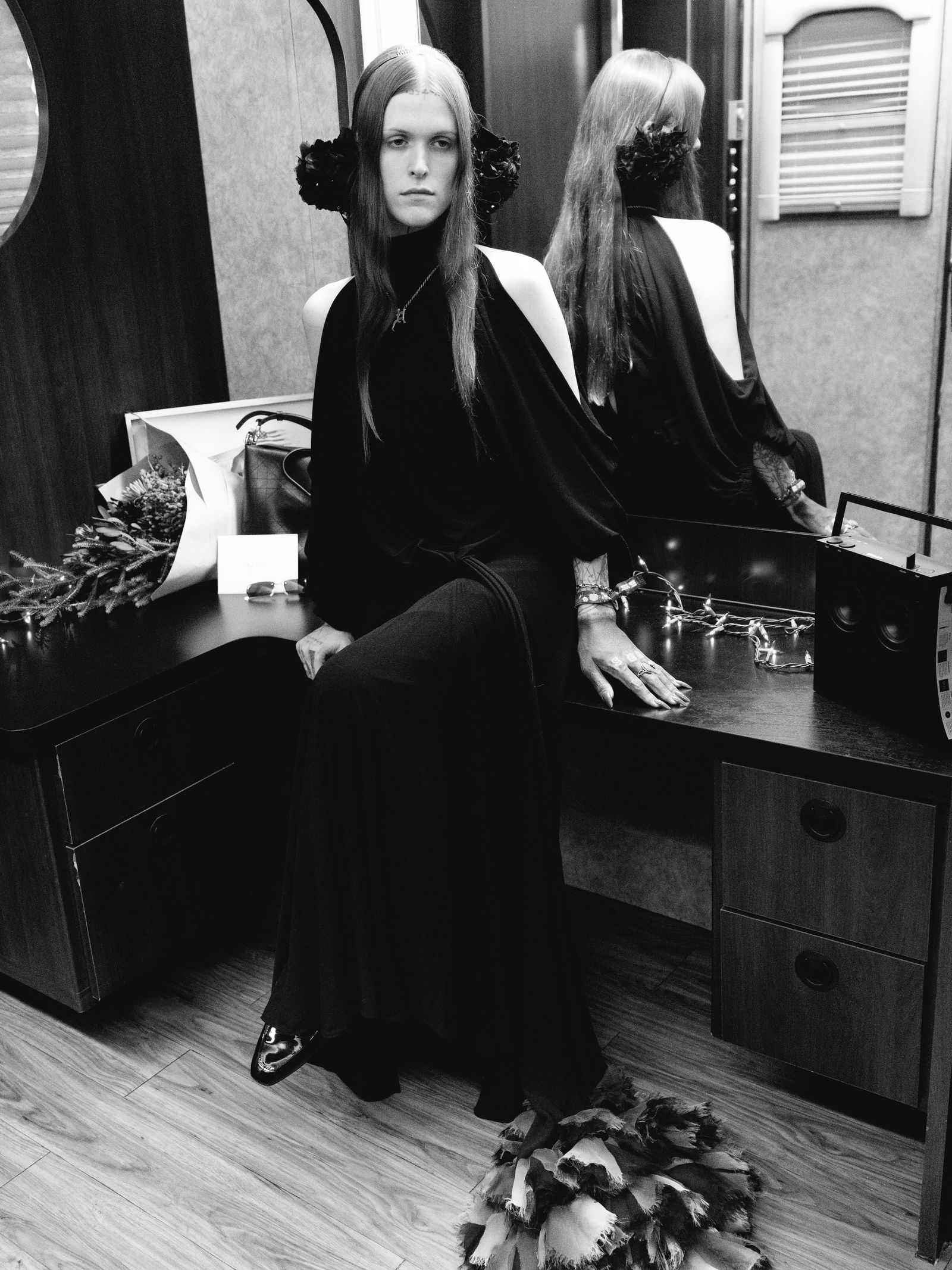 Image may contain dressing room, indoor adults, wedding accessories, bag, handbag, face sitting and head