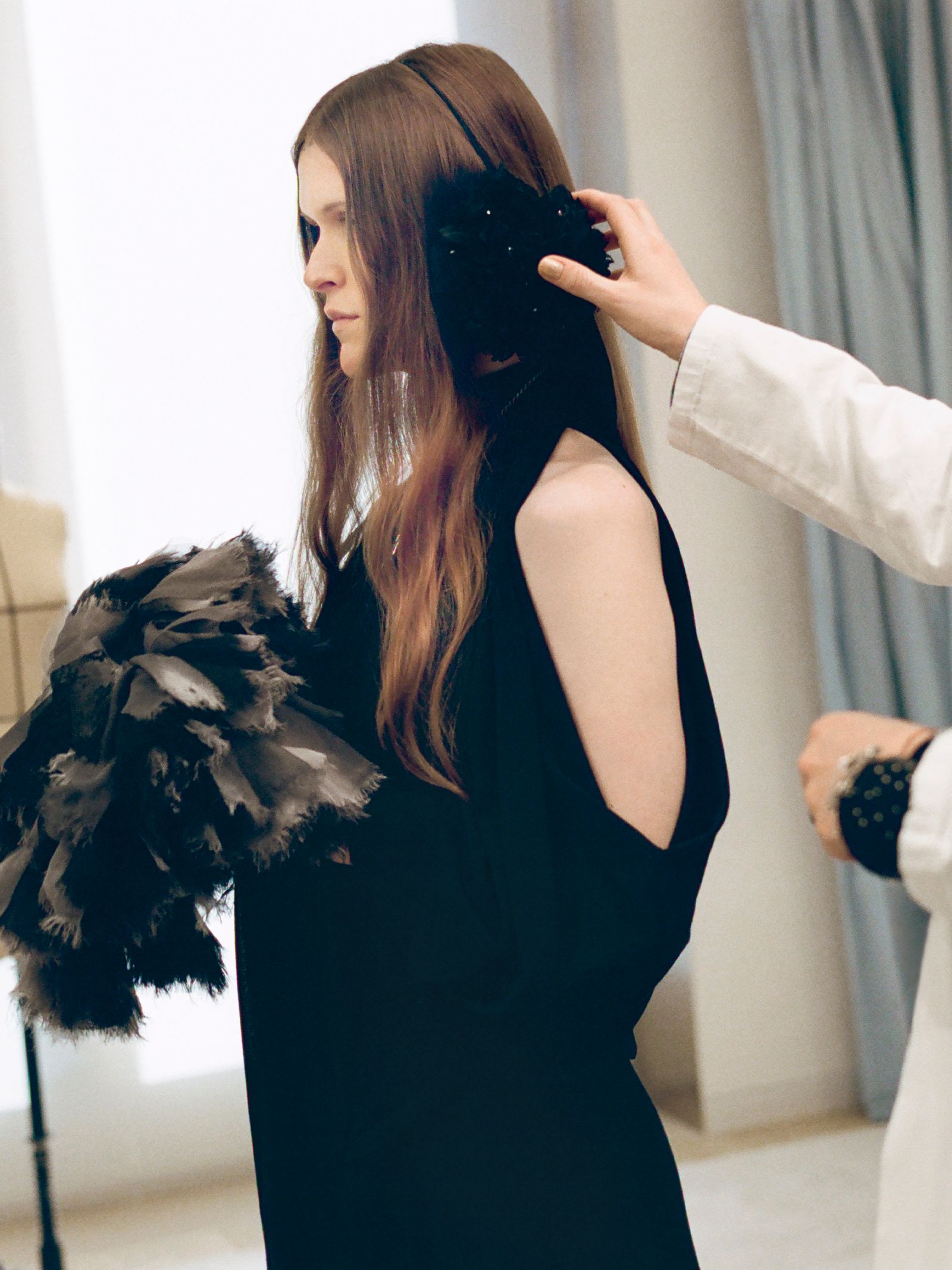 Image may contain adults with brown hair, hair, photography, clothing, dresses and heads