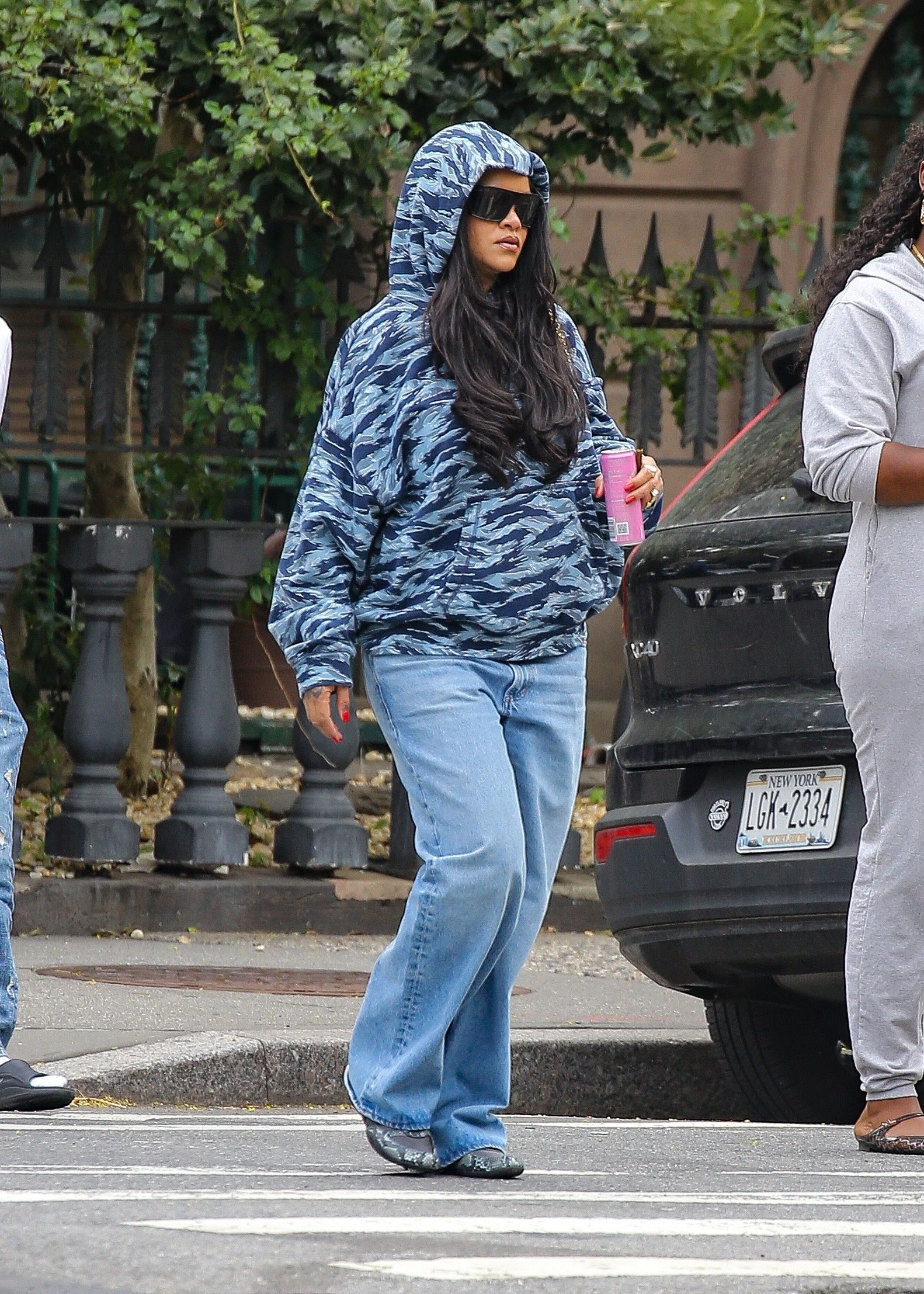 Rihanna stayed cool in a camo hoodie during a leisurely stroll in Brooklyn, New York