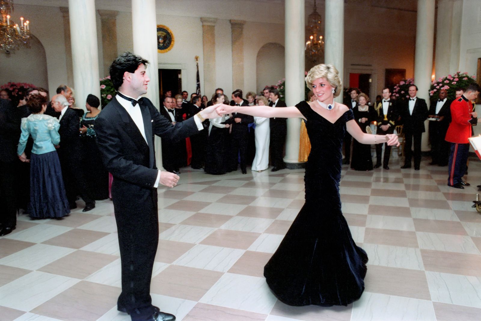 American actor John Travolta dances with Princess Diana in the Cross Hall of the White House