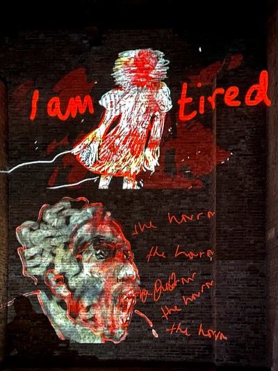 An image of a person's face scratched out and the words 