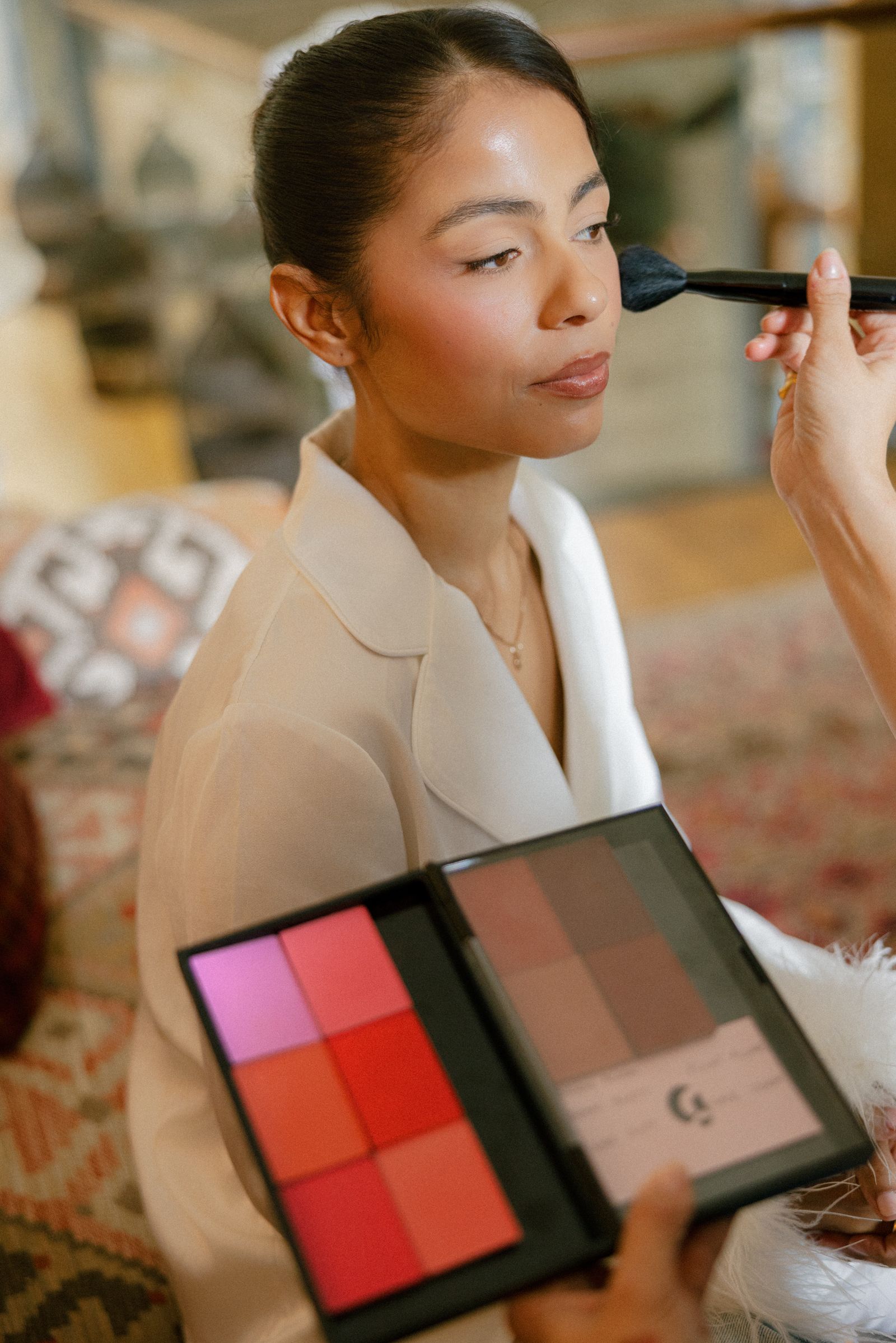 Image may contain cosmetics, adults, makeup brushes, equipment, tools, computer electronics and tablets