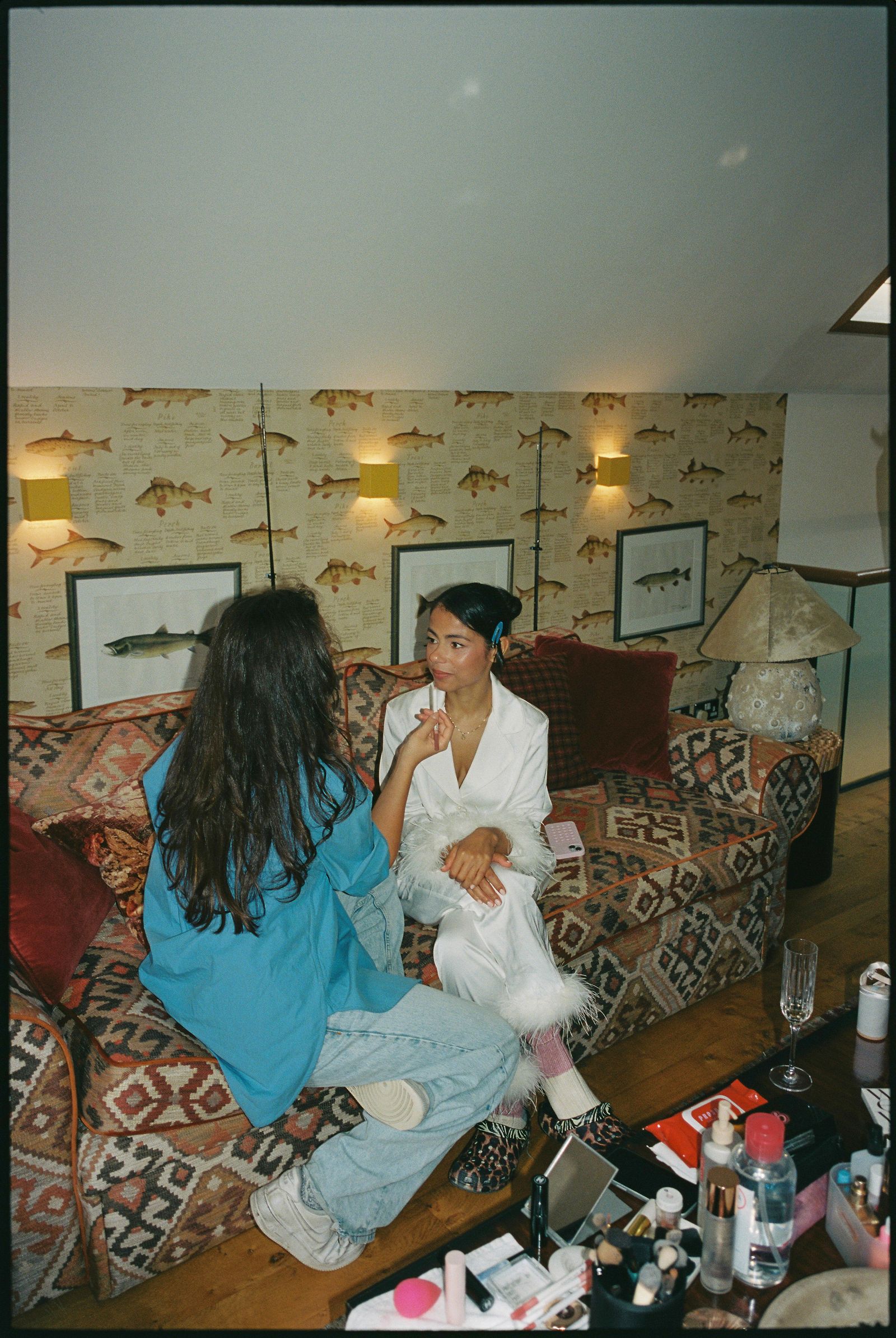 Image may contain sofa, furniture, building, architecture, interior, living room, face, head and photography