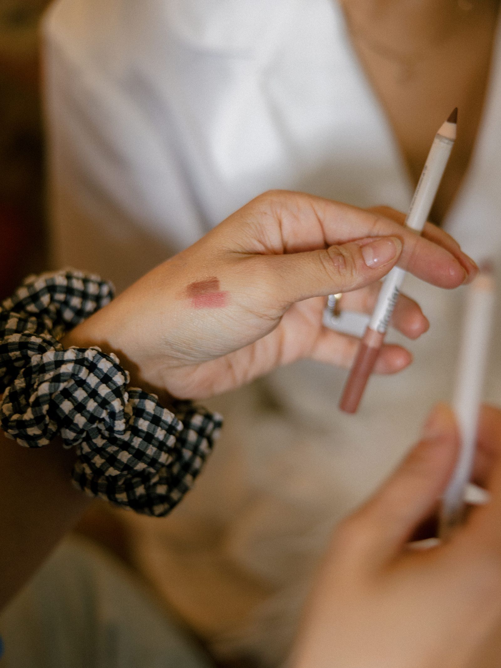 Image may contain pens, babies, human body parts, fingers, hands and cosmetics