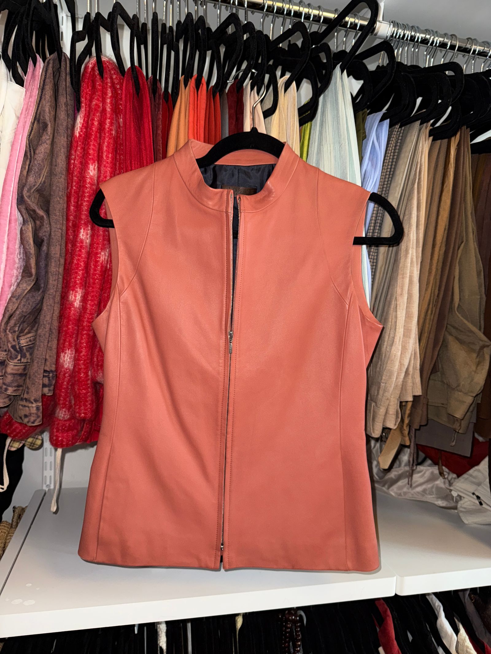 Pictures may contain clothing, vests, life vests, coats and jackets