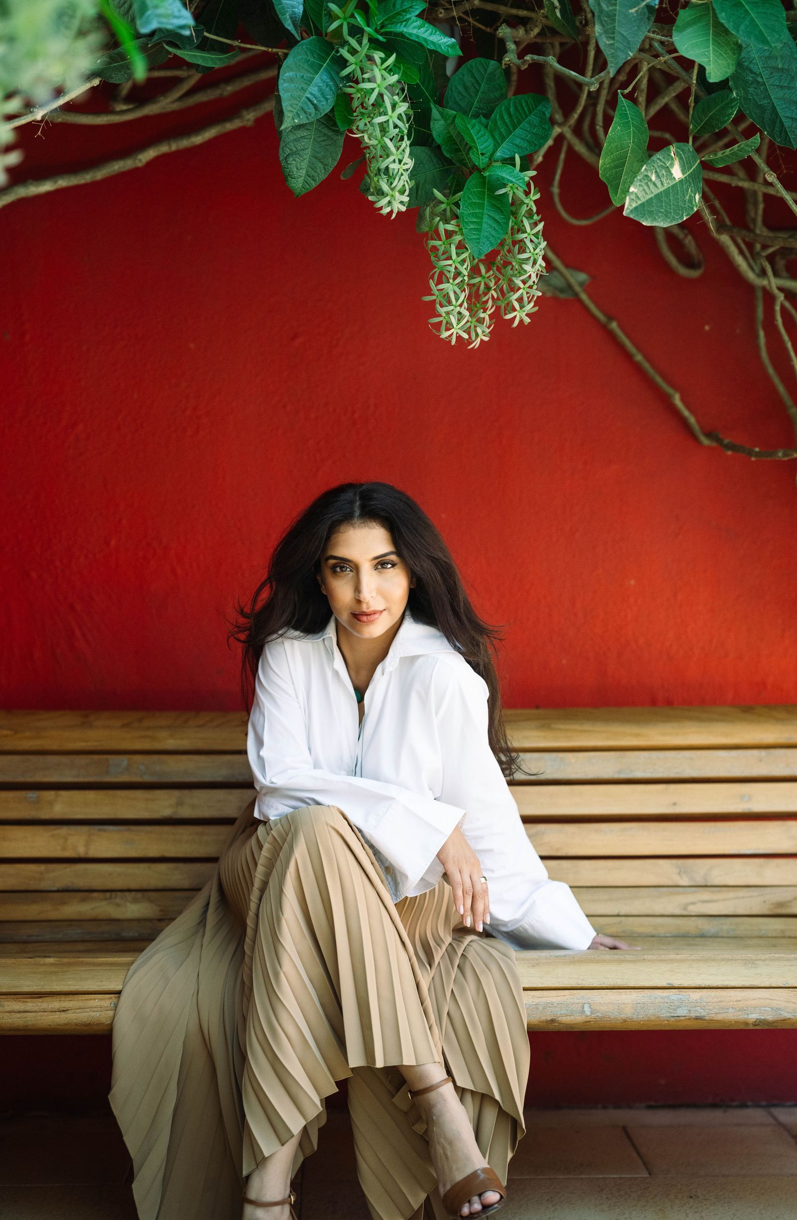 Image may show people sitting, black hair, hair, adult head and face