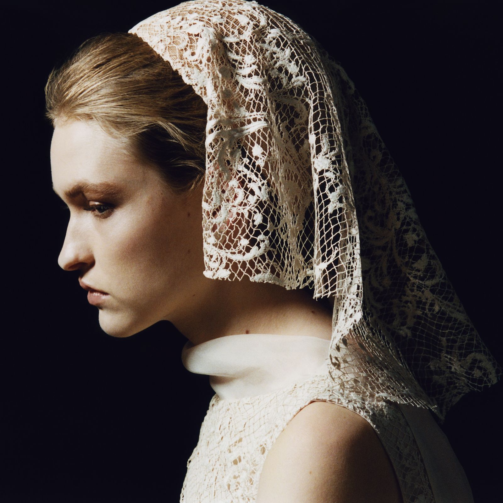 Image may contain adult wedding lace face avatar photography portrait clothing and veil