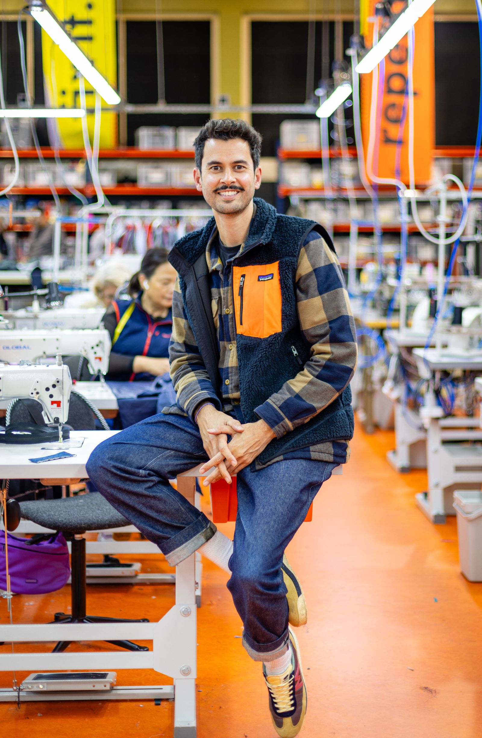 Image may contain clothing, pants, jeans, person sitting on adult face, happy head and smile