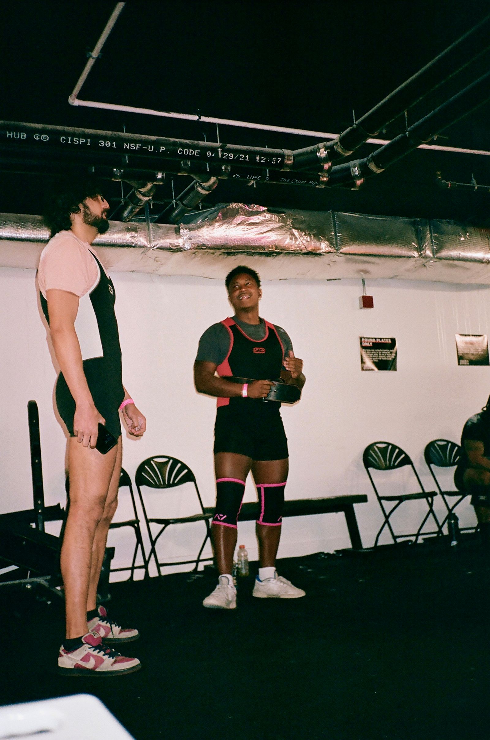 Images may contain clothing, shorts, people, adult footwear, shoes, chairs, furniture, faces, head photography and portraits