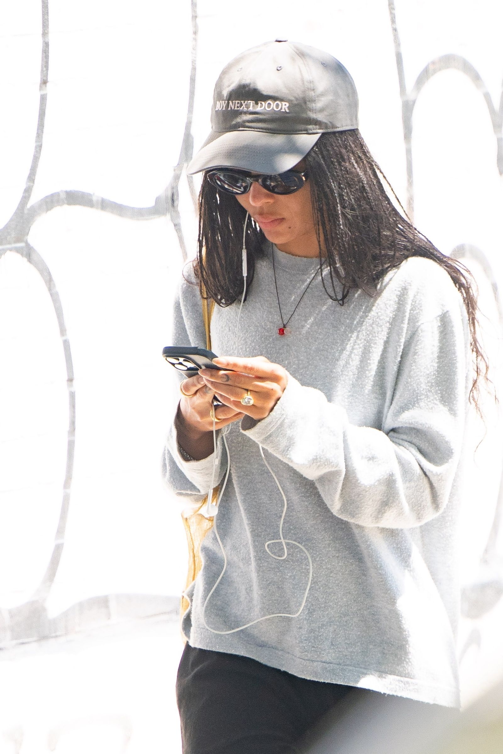 Image may contain baseball caps, hats, clothing, hats, photography, faces, adult accessories and eyewear