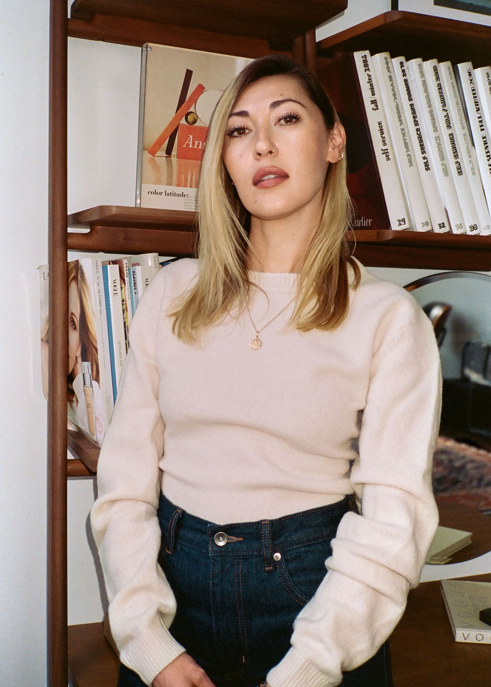 Image may contain blonde people, adult accessories, faces, heads and furniture