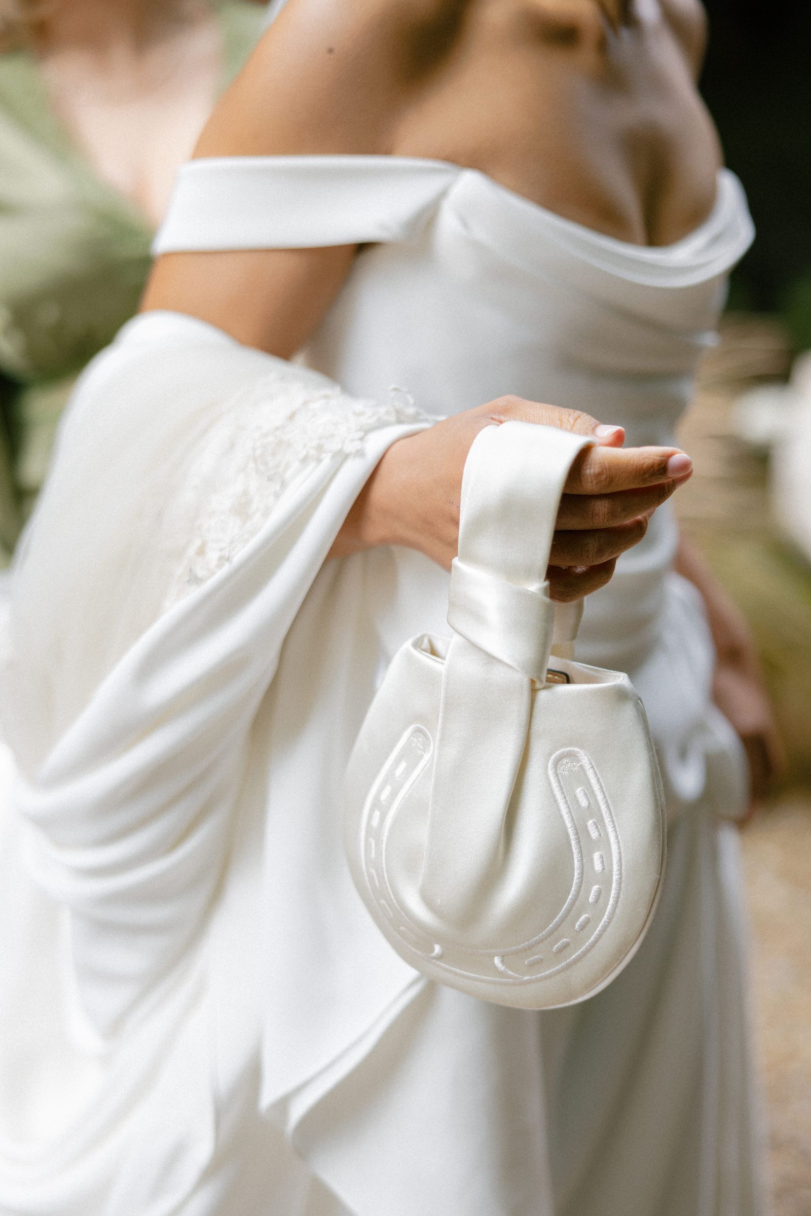 Image may contain clothing, dresses, fashionable formalwear, wedding dresses, adult body parts and fingers