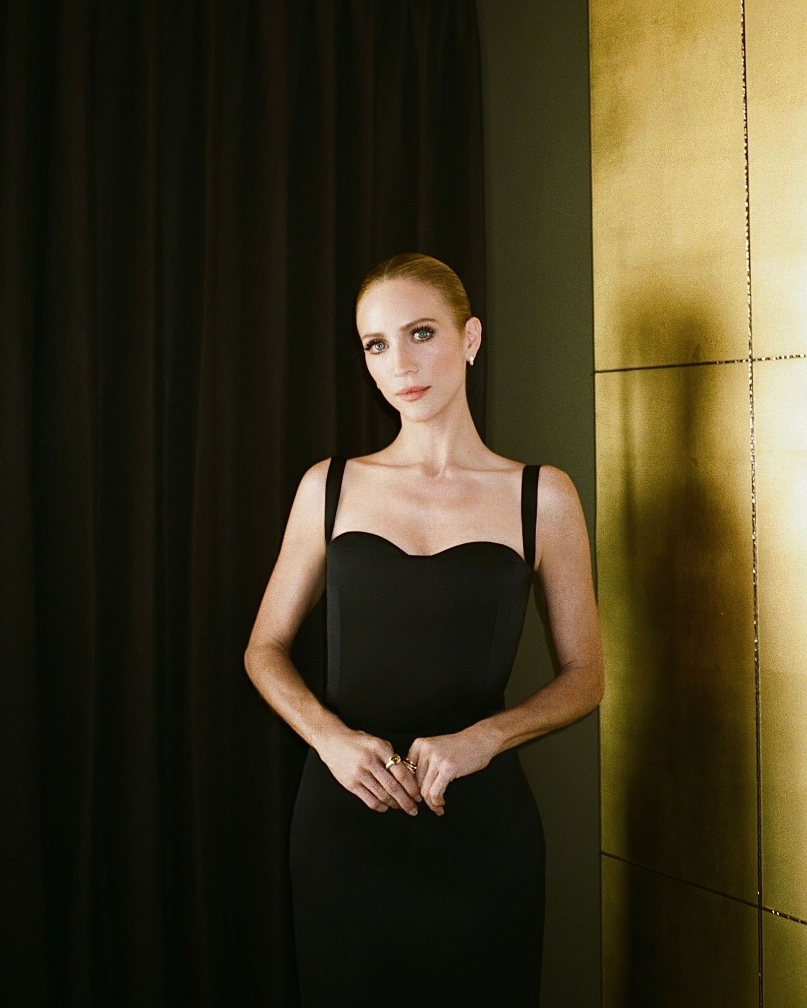 Images may contain Brittany Snow clothing, dresses, evening gowns, formal wear, faces, heads, people, photography and portraits