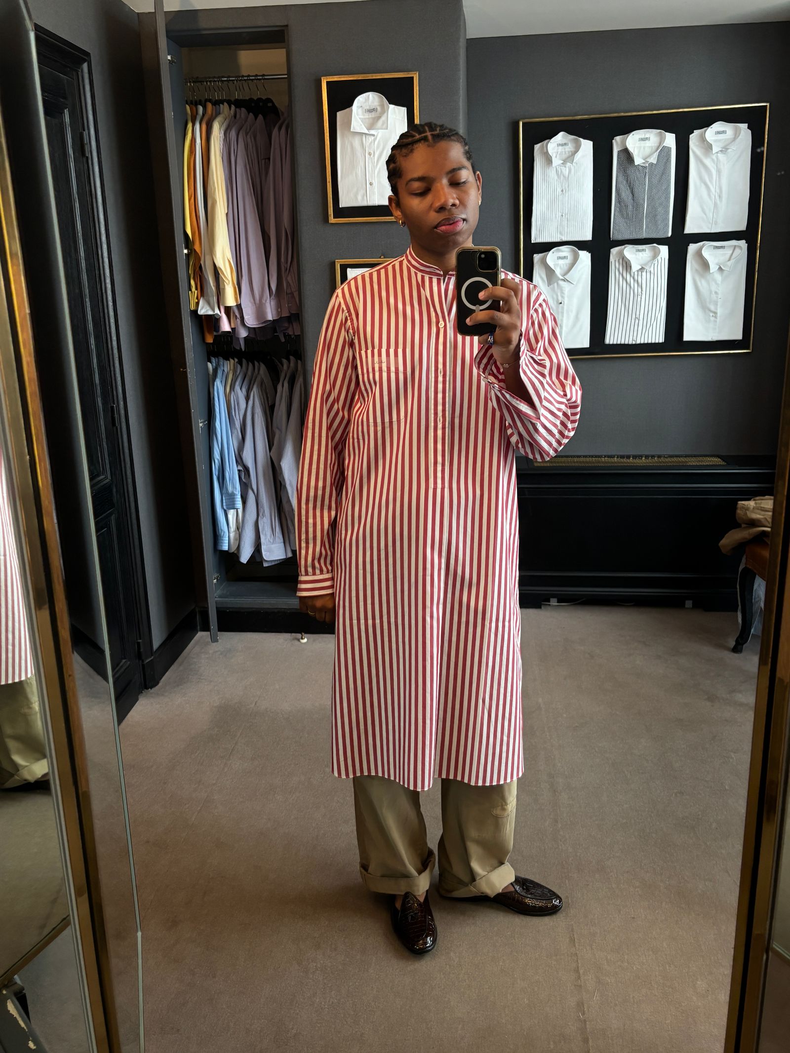 Image may show a person standing, wearing clothes, coat, adult indoors, face and head