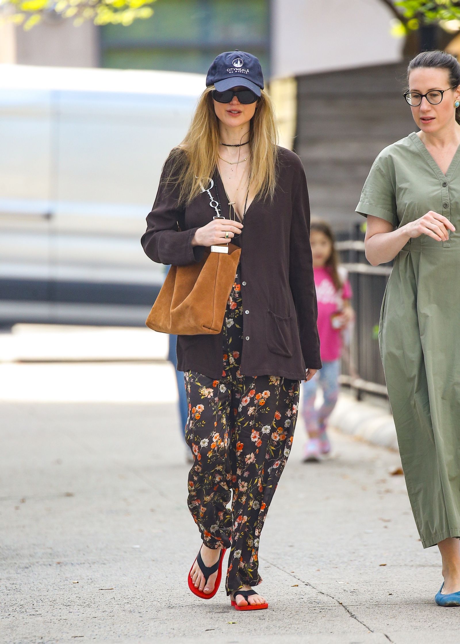 Image may contain Niamh McGrady, Jennifer Lawrence pedestrians, clothing, pants, footwear, shoes outerwear and adults