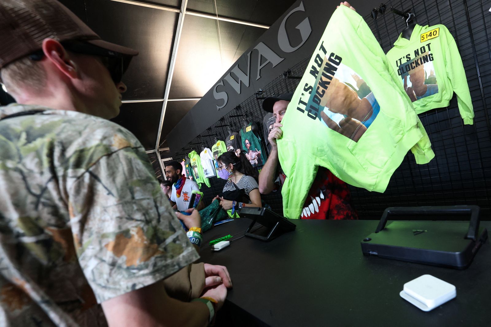 Image may contain Billel Omrani Chris Cutler computer electronics laptop adult people clothes and hat