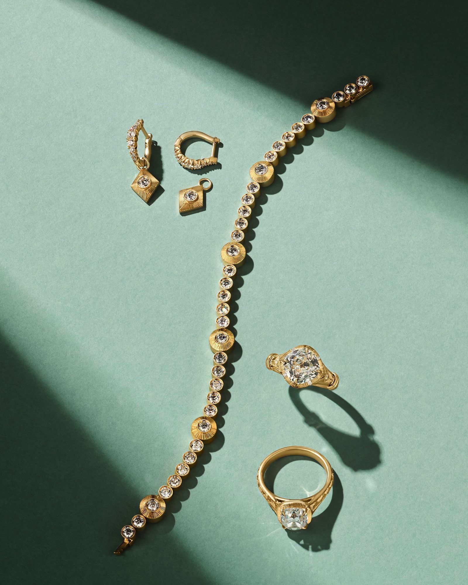 Image may contain accessories diamond gemstones jewelry earrings necklaces and gold