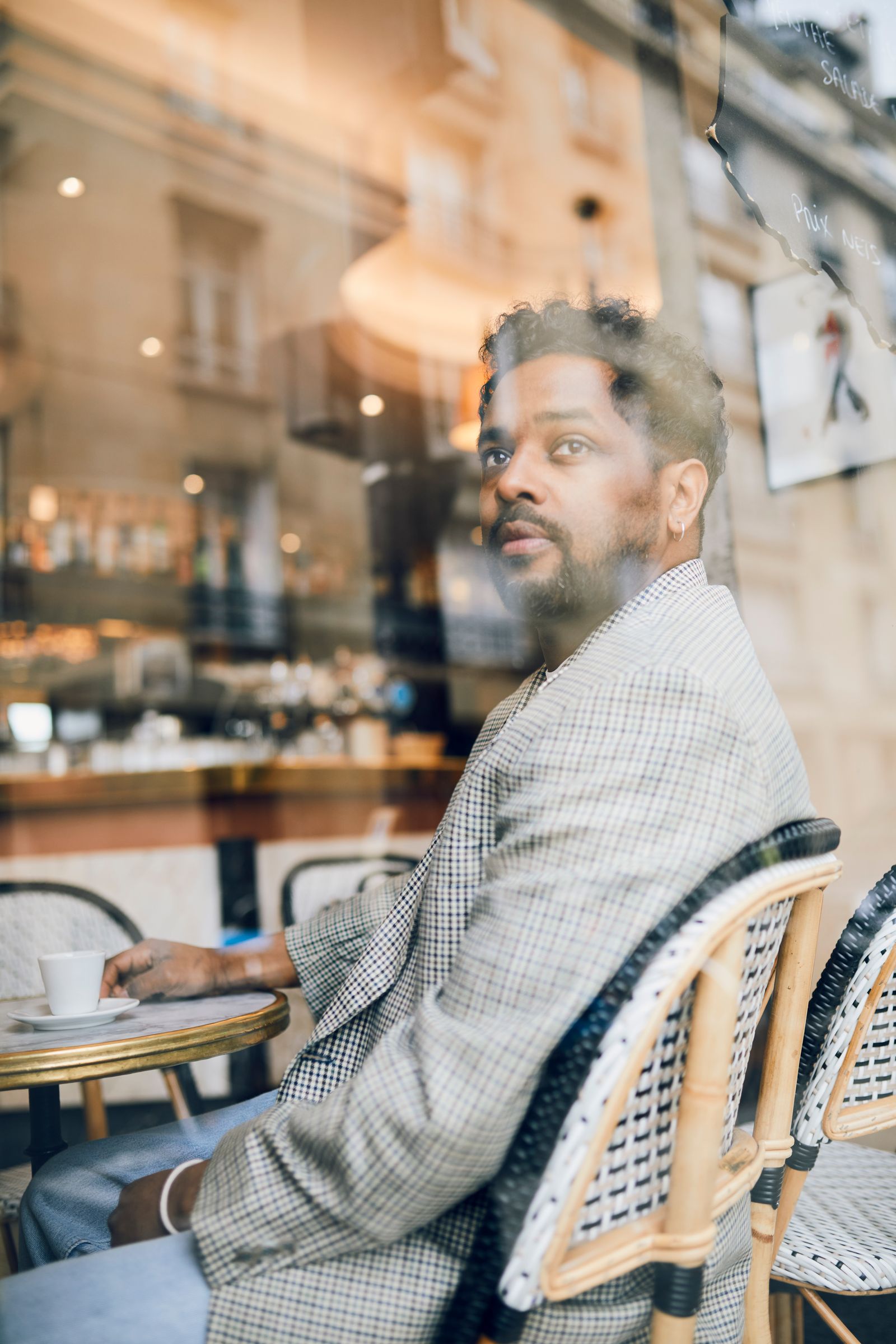 Image may show someone sitting on adult face, hair and black hair