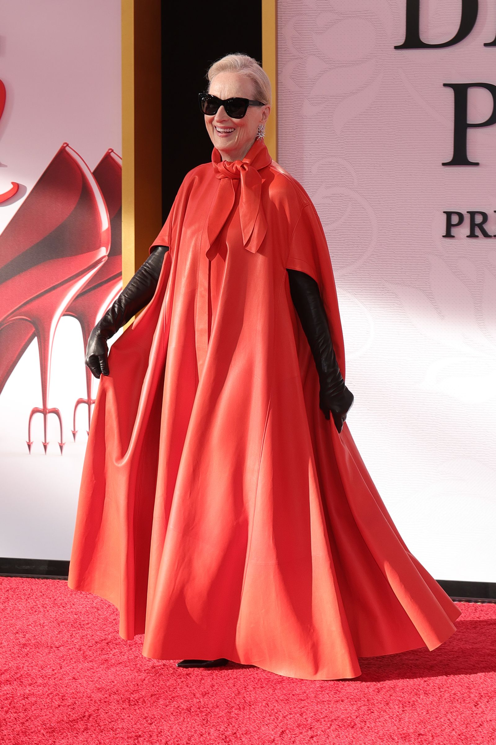Image may contain Meryl Streep fashion cape costume, gloves, dress, adults and people